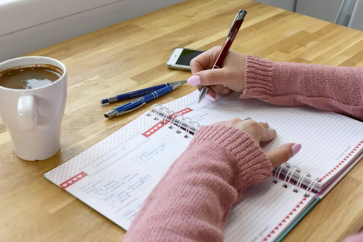 Writer drafting SEO content in a notebook